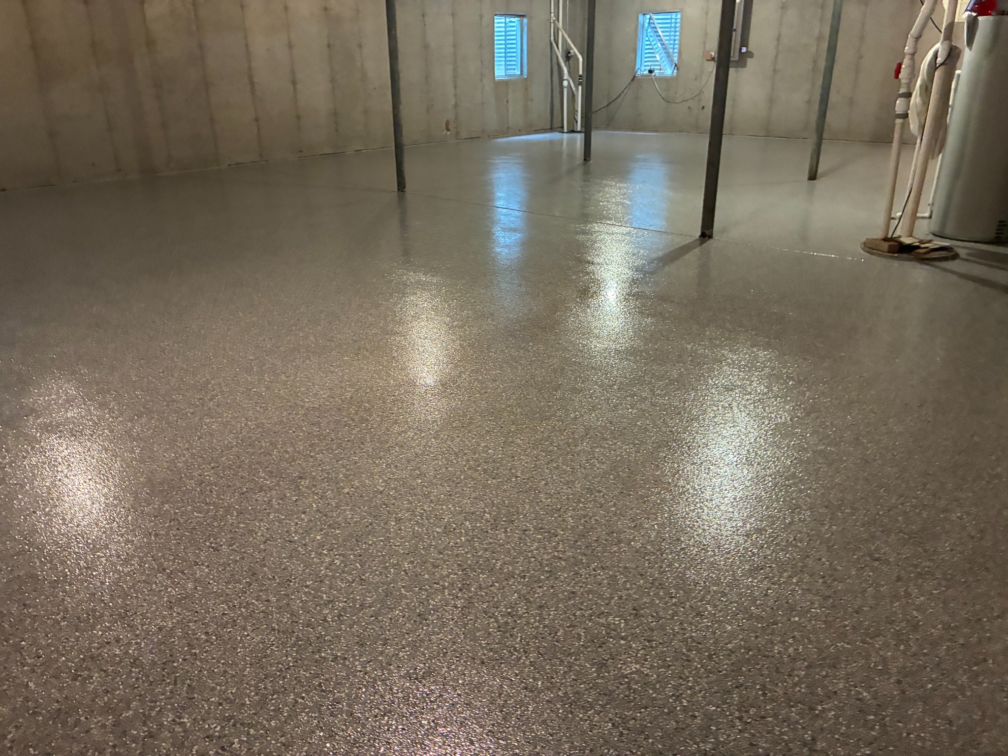 Finished residential basement flake epoxy floor, wide view