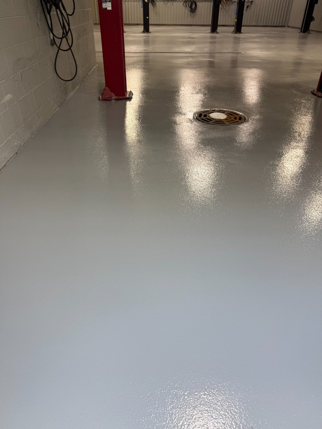 Finished epoxy broadcast floor at an Infinity dealer