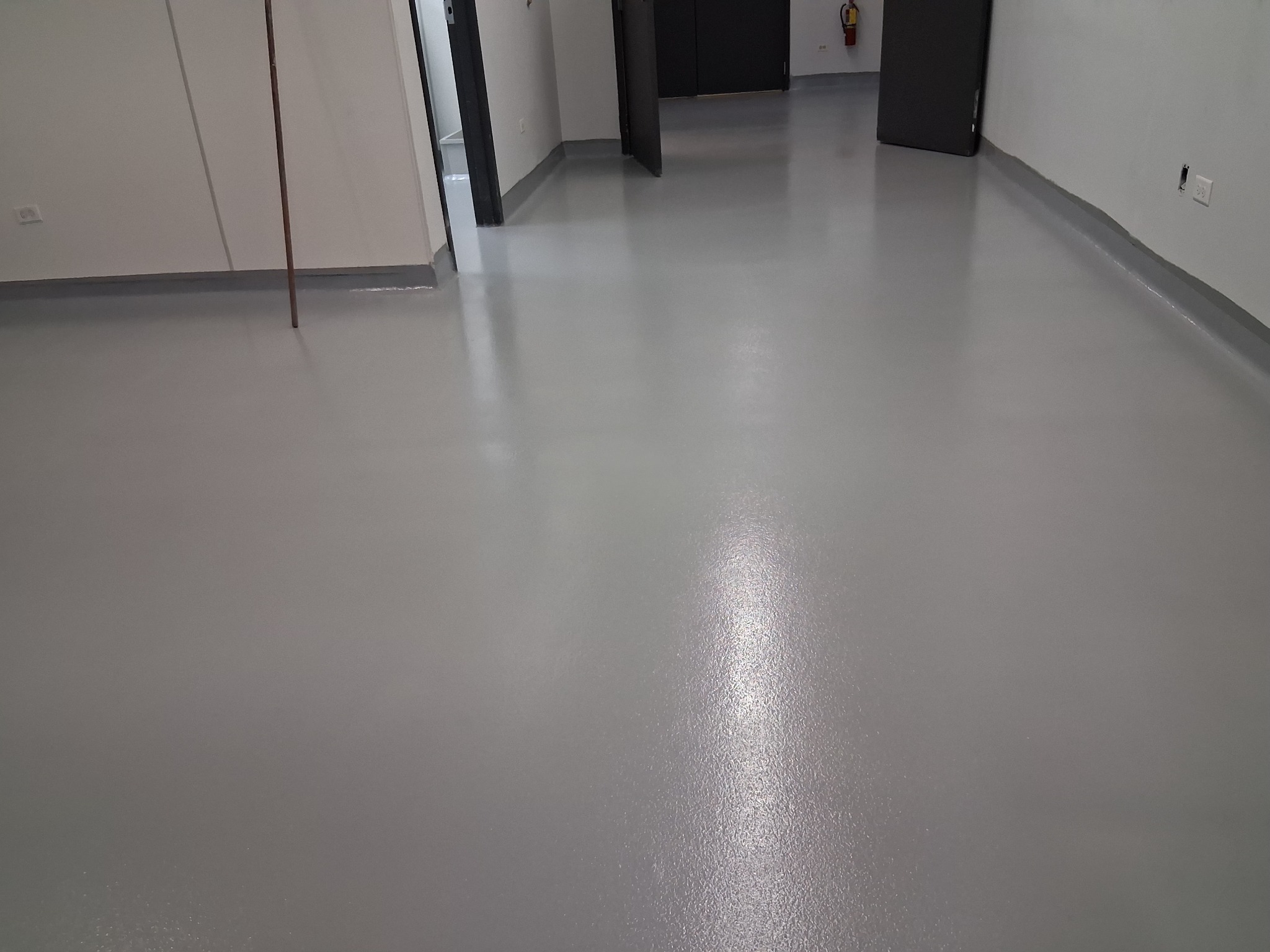 Gray commercial epoxy floor by J&J Custom Flooring