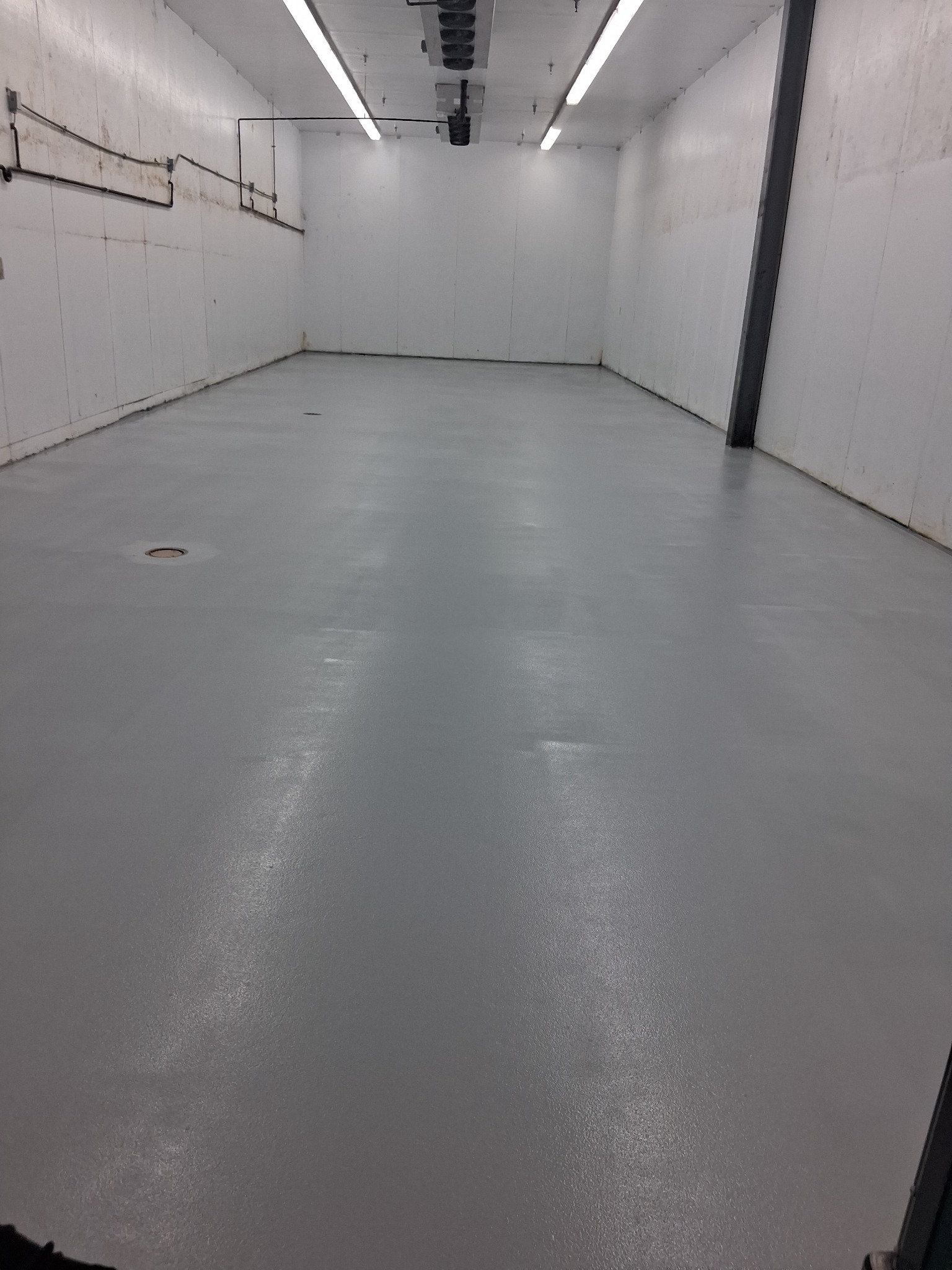 Commercial epoxy flooring mid-stage by J&J Custom Flooring