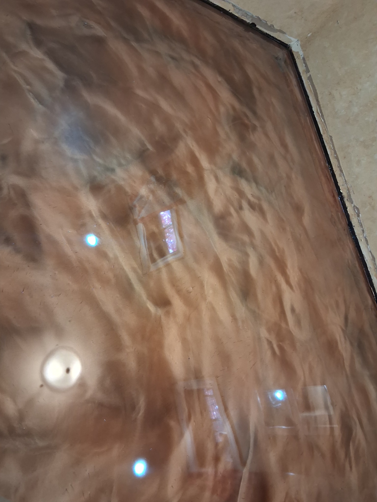 Brown metallic epoxy floor by J&J Custom Flooring